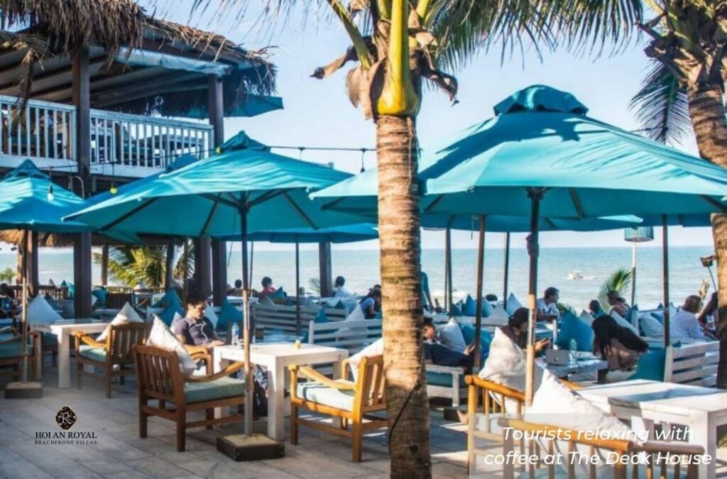 Tourists enjoying coffee and relaxing at The Deck House