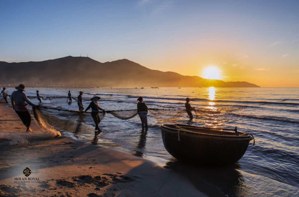 Fishermen casting nets at dawn